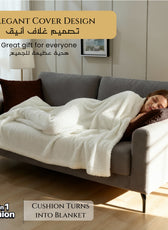 Woman lying on a couch with a white blanket by Cotton Home